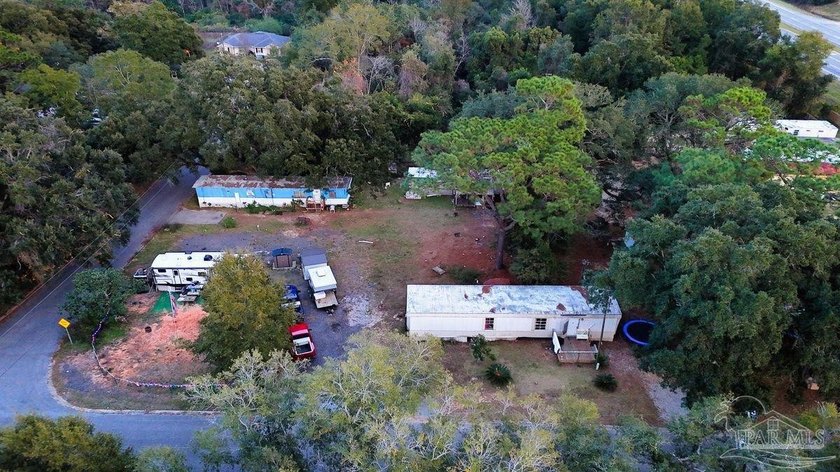 1.3 acre parcel with over 200 feet of road frontage on 9-Mile Rd - photo 5