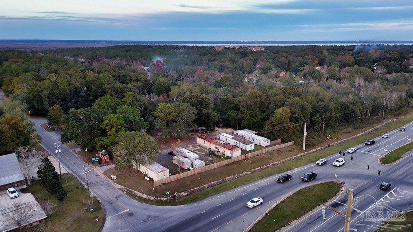 1.3 acre parcel with over 200 feet of road frontage on 9-Mile Rd - photo 9