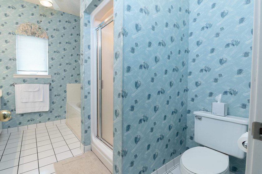 This three-bedroom, three-bath residence is priced to sell and - photo 34