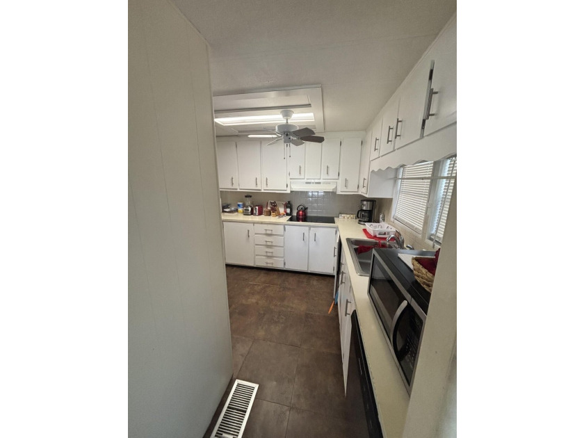 SPACIOUS HOME, VERY WELL MAINTAINED WITH 2 BEDROOMS, 2 BATHS AND - photo 19