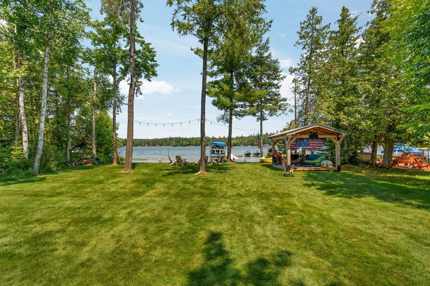 Experience exceptional lakefront living with 100 feet of - photo 2