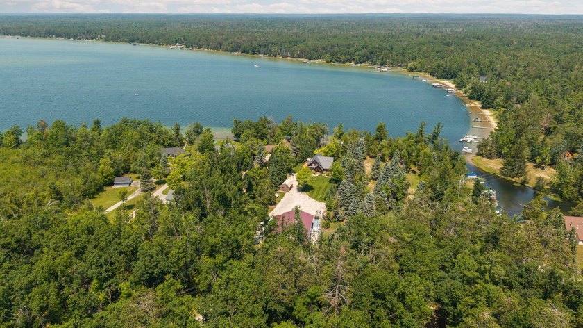 Experience exceptional lakefront living with 100 feet of - photo 7
