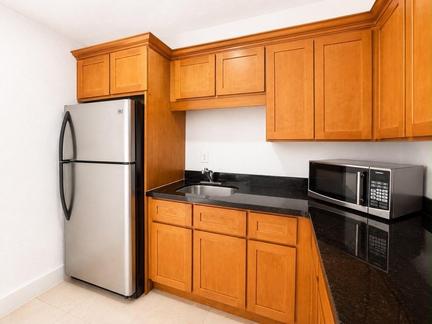 Welcome to this efficient 1-bedroom, 1-bathroom corner unit at - photo 5