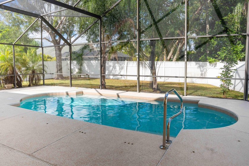 Discover this amazing home Pool home featuring 3 bedrooms, 2 - photo 16
