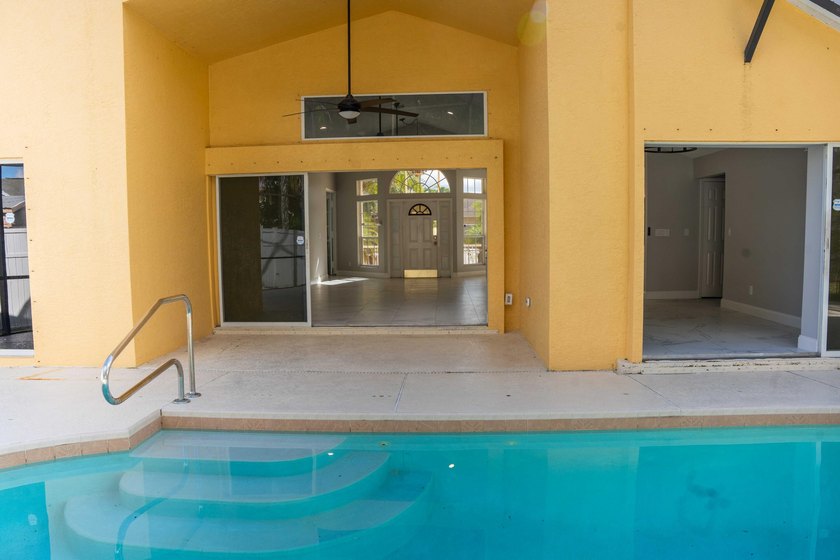 Discover this amazing home Pool home featuring 3 bedrooms, 2 - photo 20