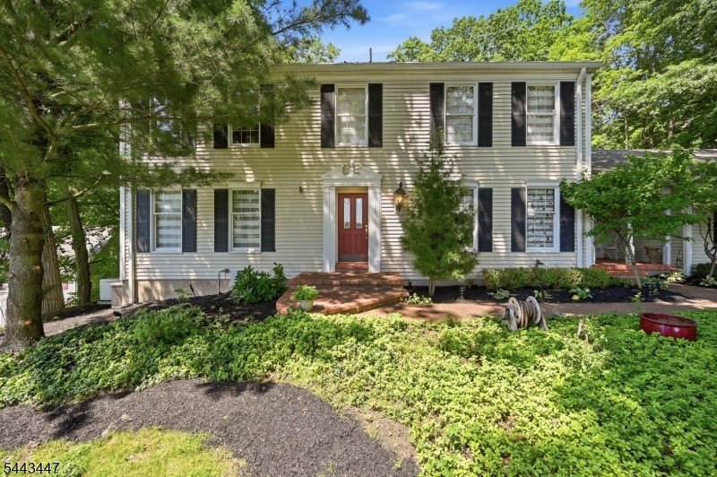 Welcome to this custom built center hall colonial located in the - photo 2