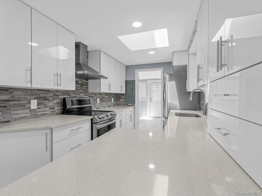 Welcome to this fully renovated ranch-style residence in the - photo 11