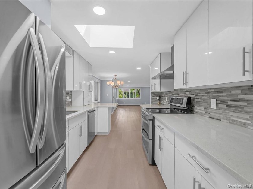 Welcome to this fully renovated ranch-style residence in the - photo 12