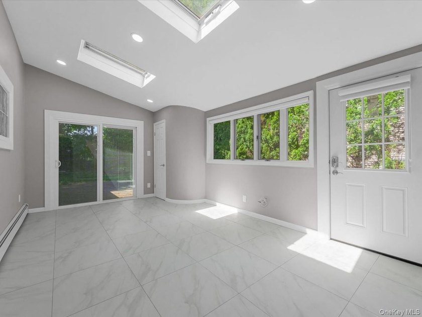 Welcome to this fully renovated ranch-style residence in the - photo 13