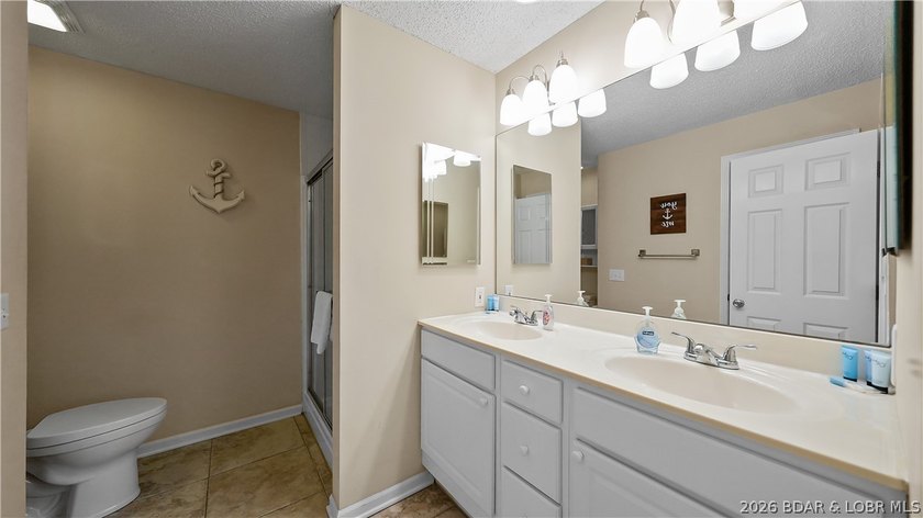 This fully furnished lakefront home is perfect for full-time - photo 23