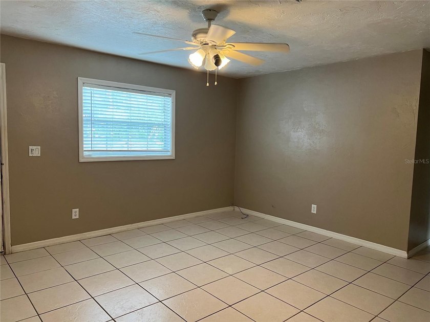 Welcome home to this charming 4-bedroom, 2-bath concrete block - photo 3