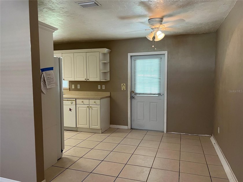 Welcome home to this charming 4-bedroom, 2-bath concrete block - photo 6