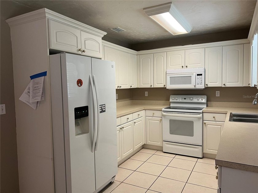 Welcome home to this charming 4-bedroom, 2-bath concrete block - photo 8