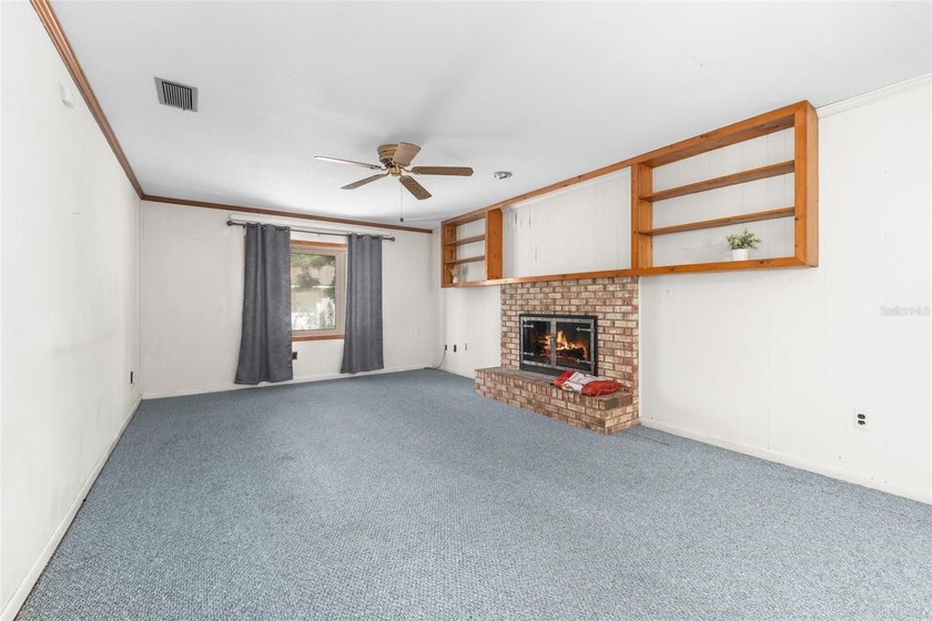 Welcome to your new home! Nestled on a spacious half-acre lot in - photo 3