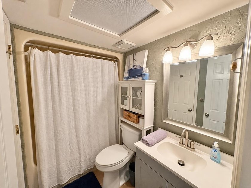 Wake up to peaceful lake views in this Beautifully Maintained - photo 12