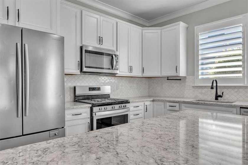 Move-in-ready and beautifully upgraded, this 3-bed + den, 2-bath - photo 13
