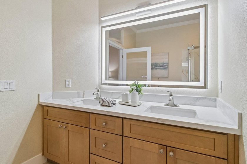 Rarely available, this townhouse-style condo is inside the - photo 30