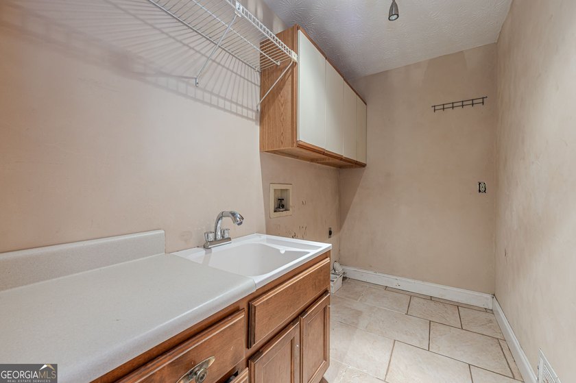 Welcome to 137 Broadwater Court in the highly sought-after gated - photo 18