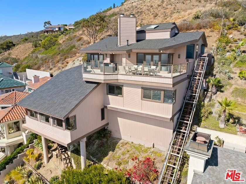 Perched above one of Orange County's most coveted stretches of - photo 36