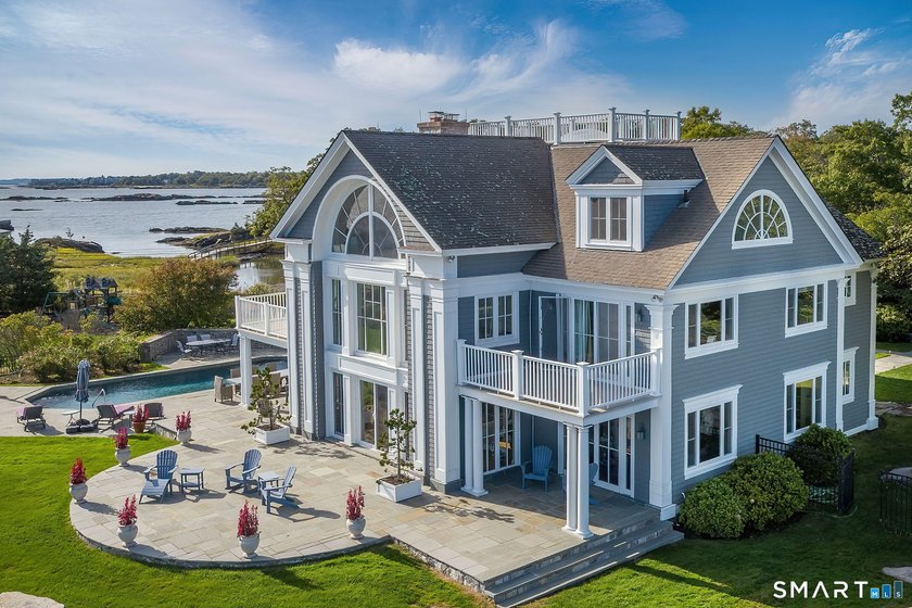 This magical light-filled New England 7,945 s.f. *cottage* takes - photo 4