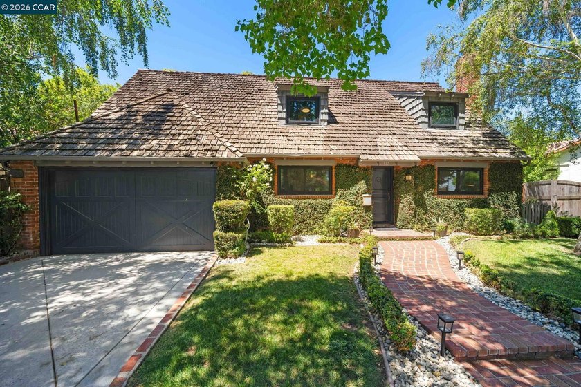 Behind the ivy-covered brick and shingled rooflines of this 1936 - photo 3