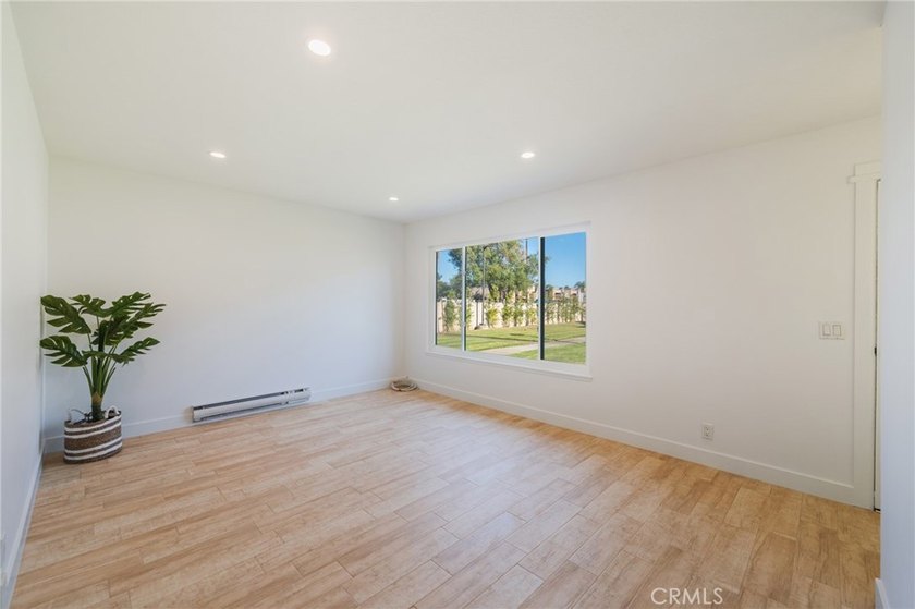 Welcome Home to this Beautifully Maintained Updated End-Unit - photo 5