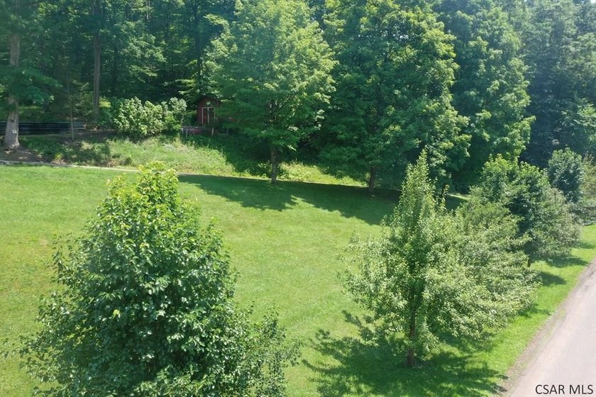 Nestled on 5.6 beautiful wooded acres in scenic Lower Turkeyfoot - photo 2