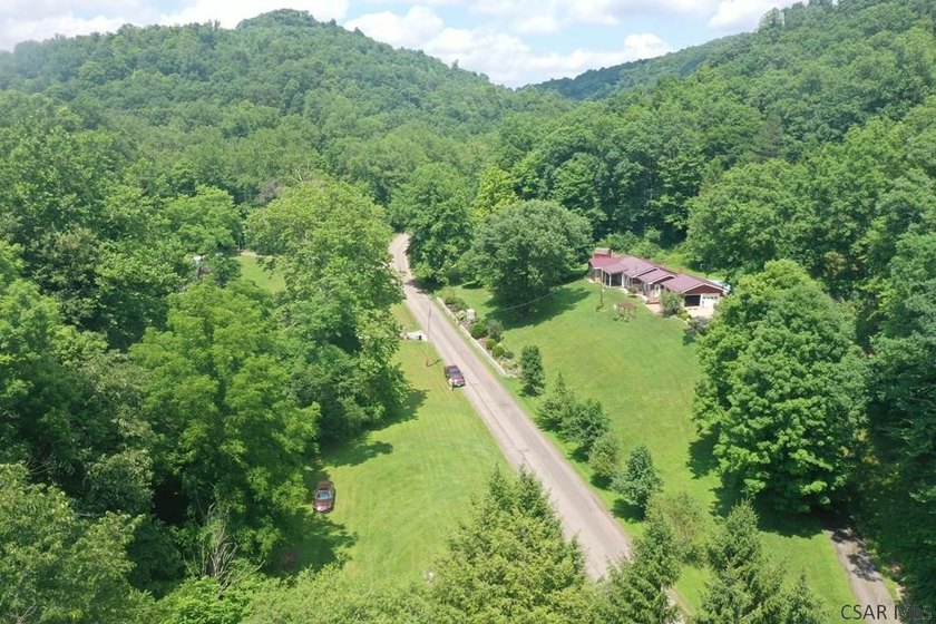Nestled on 5.6 beautiful wooded acres in scenic Lower Turkeyfoot - photo 9