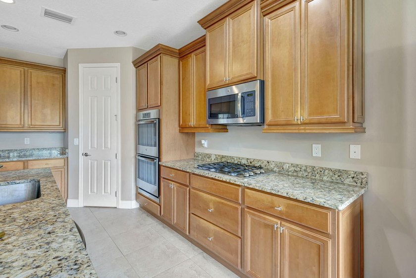 This beautiful home features four bedrooms, three bathrooms, and - photo 19