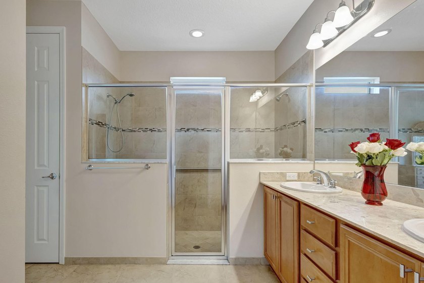 This beautiful home features four bedrooms, three bathrooms, and - photo 24