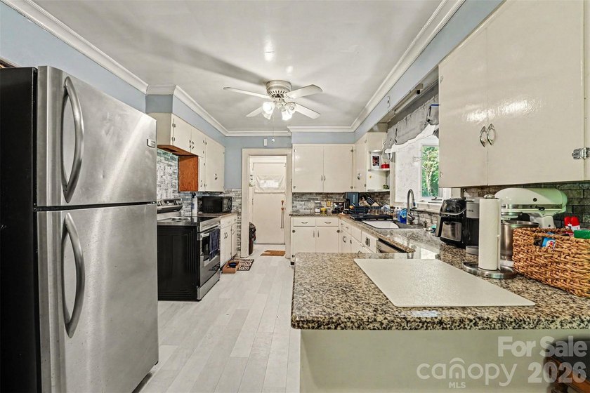Discover the lasting value of this 3BD/3BA brick home on a rare - photo 11