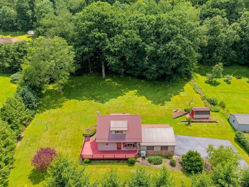 Welcome to 313 Naylor Road, a captivating 1.5-story residence - photo 4