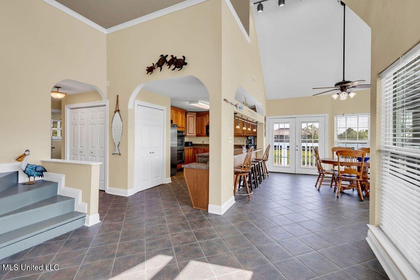 Located on a spacious waterfront lot in Bay St. Louis, this - photo 10