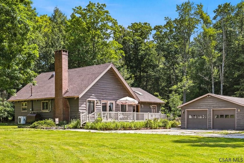 Welcome to this charming 2-bedroom, 2-bath A-Frame home nestled - photo 2