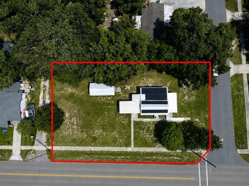 PAID OFF SOLAR + OVERSIZED LOT + METAL ROOF + WATER FILTRATION - photo 3