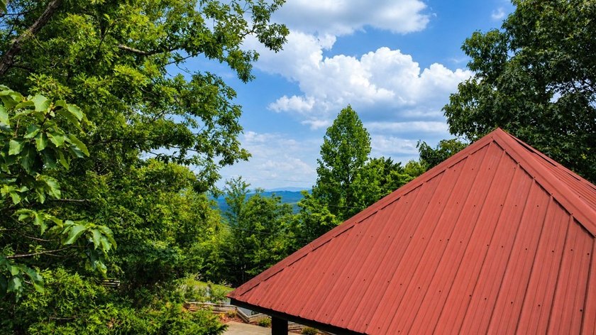 Tucked into a private wooded setting on top of the mountain in - photo 17