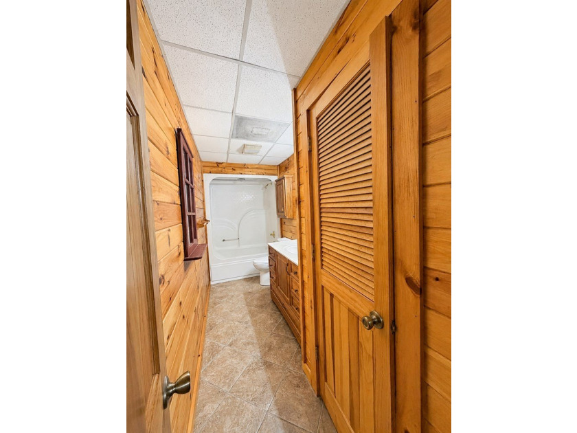 Tucked into a private wooded setting on top of the mountain in - photo 24