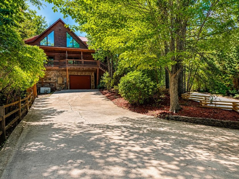 Tucked into a private wooded setting on top of the mountain in - photo 31