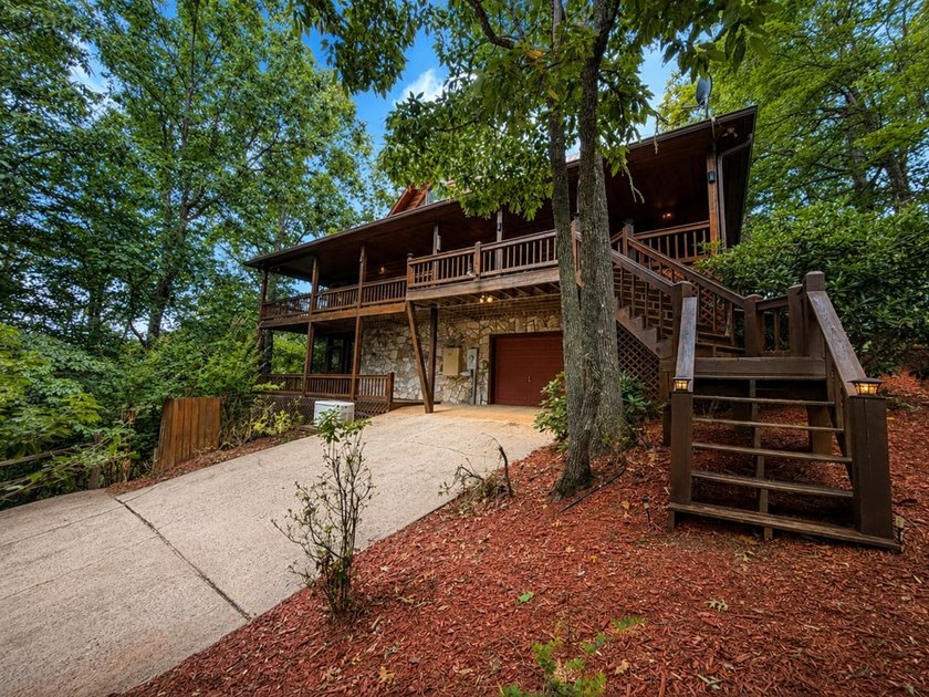Tucked into a private wooded setting on top of the mountain in - photo 32