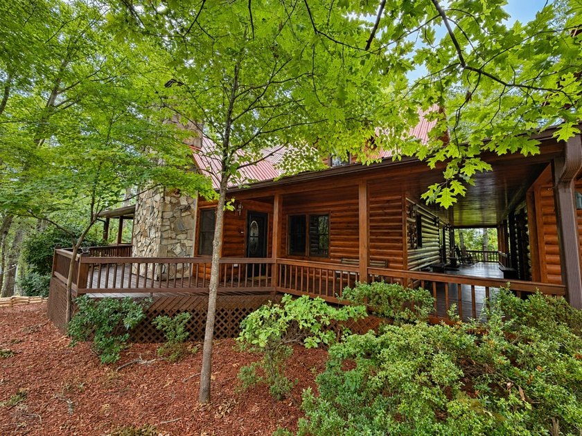 Tucked into a private wooded setting on top of the mountain in - photo 33