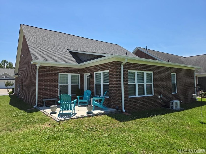 This beautiful 3-bedroom, 3-bathroom brick patio home is only - photo 2