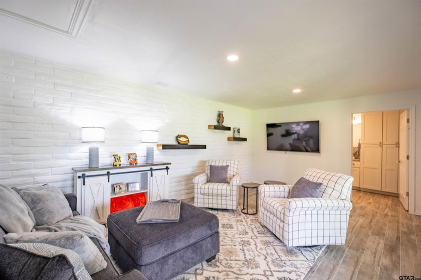 Main lake waterfront with private dock, updated interior, and - photo 21