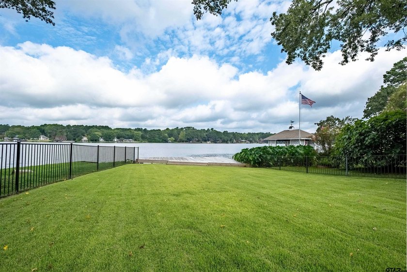 Main lake waterfront with private dock, updated interior, and - photo 26