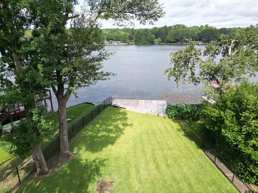 Main lake waterfront with private dock, updated interior, and - photo 33