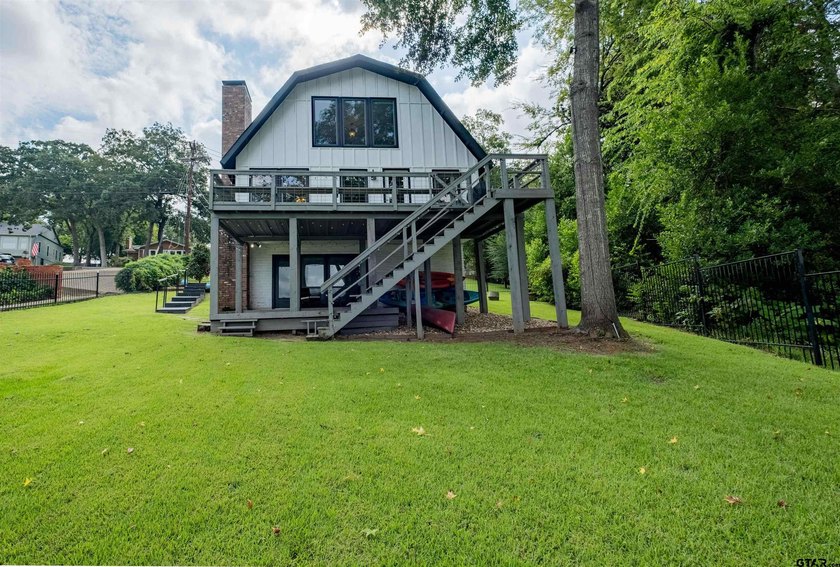 Main lake waterfront with private dock, updated interior, and - photo 34