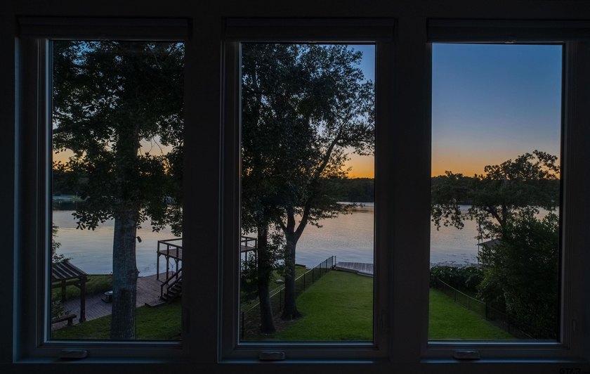 Main lake waterfront with private dock, updated interior, and - photo 37