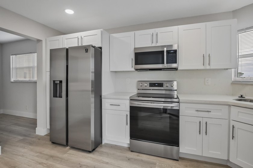 HURRY! THIS UPDATED, BRIGHT, CORNER CONDO IS PRICED BELOW MARKET - photo 3