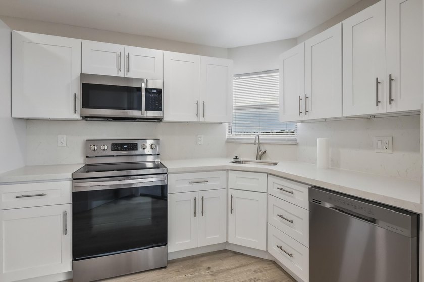 HURRY! THIS UPDATED, BRIGHT, CORNER CONDO IS PRICED BELOW MARKET - photo 4