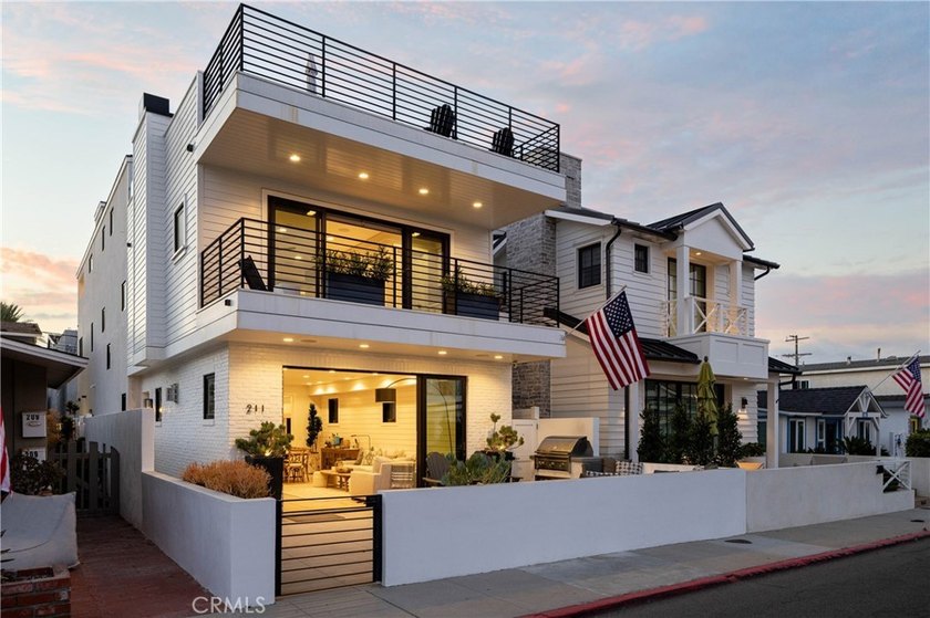 Just one block from the sand, this custom-built Newport Beach - photo 2
