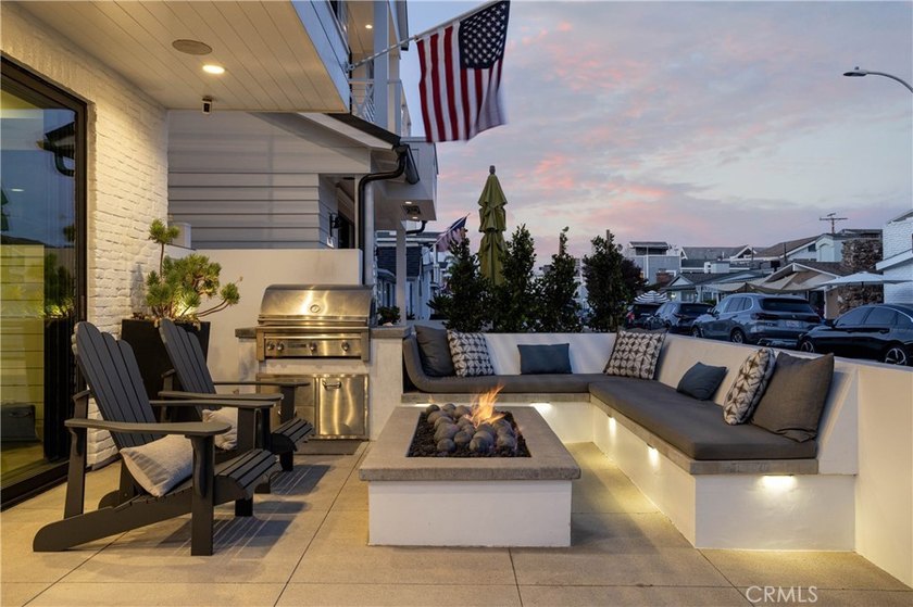 Just one block from the sand, this custom-built Newport Beach - photo 4
